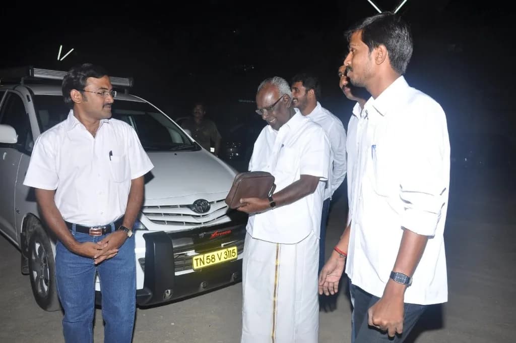 AirMedia team with a VIP guest outdoors at night