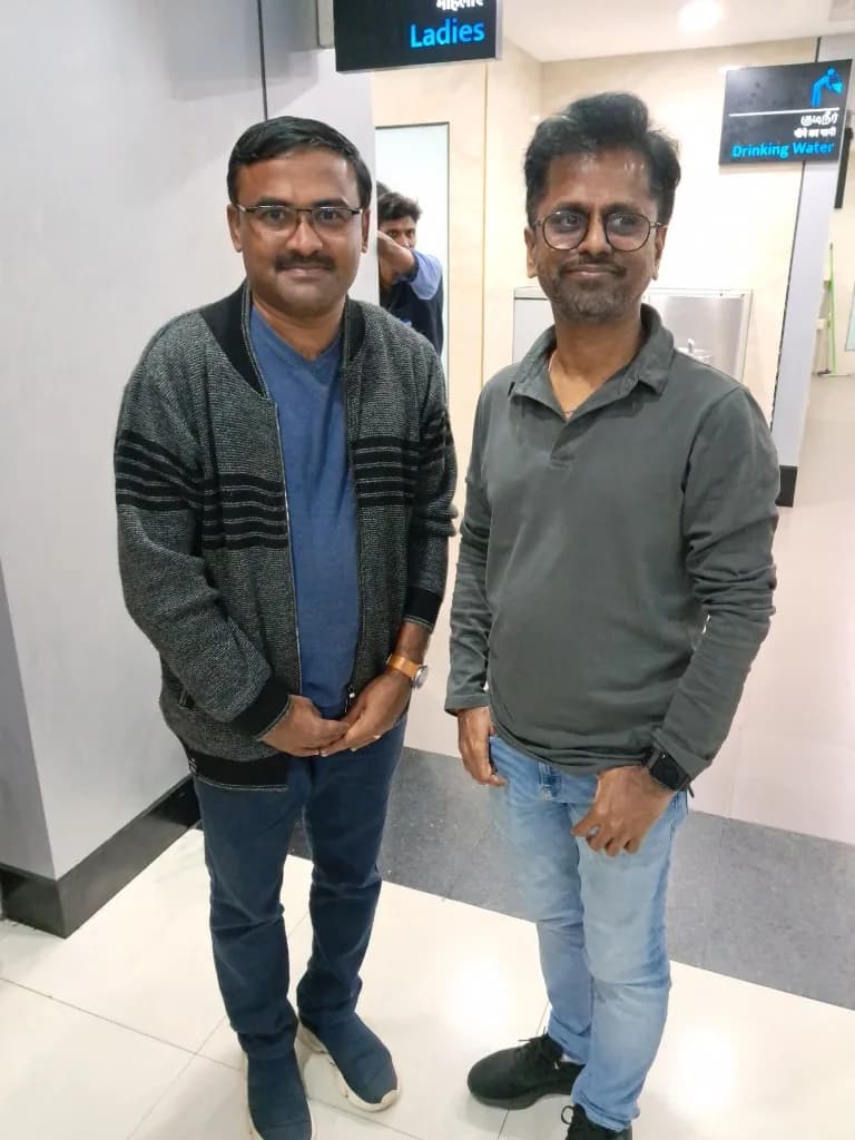 AirMedia team member with a guest at an airport