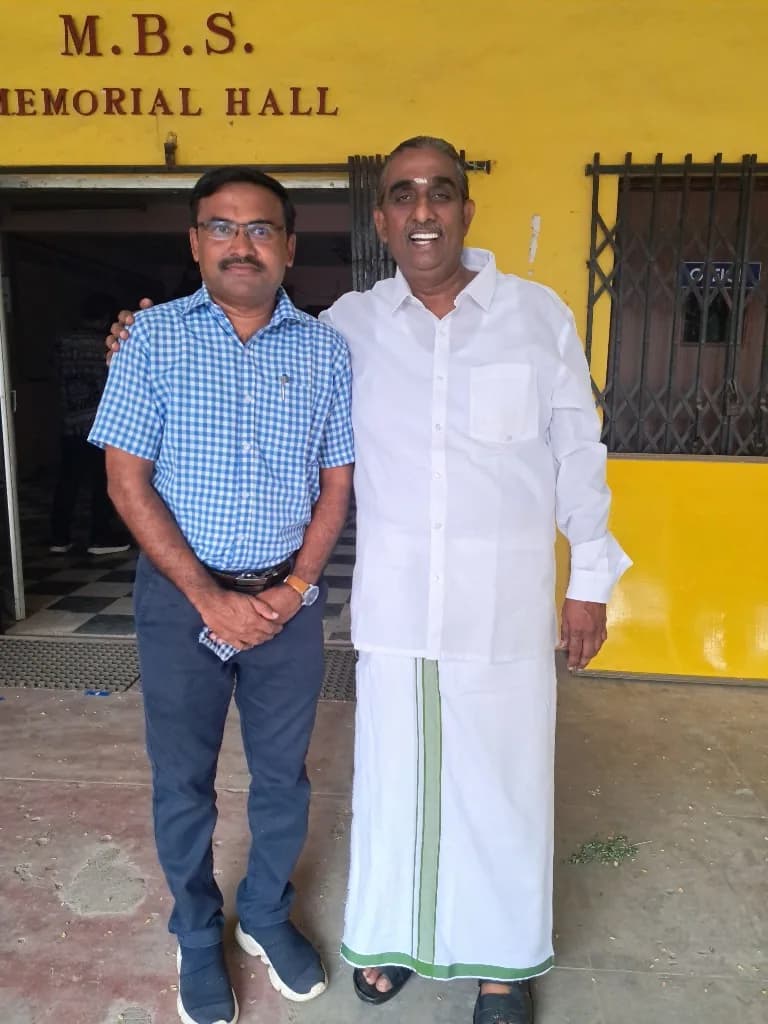 P. Vijayakumar with a guest outside M.B.S. Memorial Hall